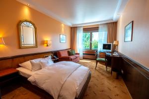 Ein Bett oder Betten in einem Zimmer der Unterkunft Insel-Hotel Heilbronn