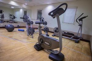 a gym with several exercise bikes in a room at Ibis Lagos Airport in Ikeja