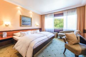 Ein Bett oder Betten in einem Zimmer der Unterkunft Insel-Hotel Heilbronn