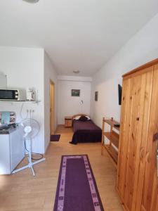 Posteľ alebo postele v izbe v ubytovaní Hungaria Apartments