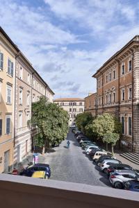 a street with cars parked in a parking lot at Appartamento a uso turistico in Viterbo