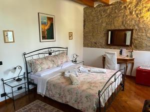 Posteľ alebo postele v izbe v ubytovaní B&B QUINTARELLI