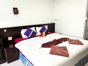 Postel nebo postele na pokoji v ubytování Lamai Apartment