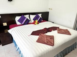 Postel nebo postele na pokoji v ubytování Lamai Apartment