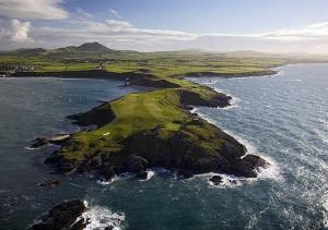 an aerial view of a golf island in the ocean at Ty Ni in Nefyn