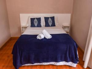 Pousada Baía dos Corais tesisinde bir odada yatak veya yataklar