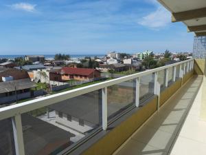 a balcony with a view of a city at Residencial Lazzari Apto 402 in Arroio do Sal