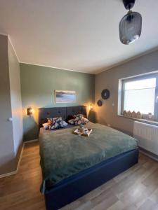 a bedroom with a large bed and a window at Lagerhaus Gabriel in Zweibrücken