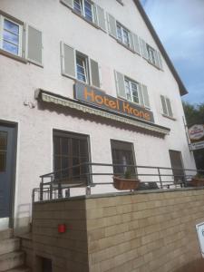 a hotel home with a sign on the side of it at Hotel Krone Bad Cannstatt in Stuttgart
