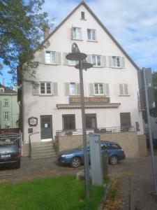 a street sign in front of a house at Hotel Krone Bad Cannstatt in Stuttgart