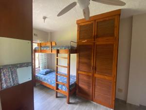 a bedroom with two bunk beds and a ladder at See Uitsig 2 in Uvongo Beach