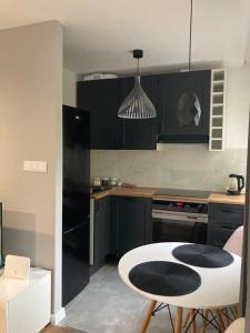 Η κουζίνα ή μικρή κουζίνα στο Apartament Bema 89b
