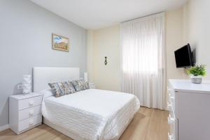Ένα ή περισσότερα κρεβάτια σε δωμάτιο στο Home2Book Charming Apartment Puertito de Güímar