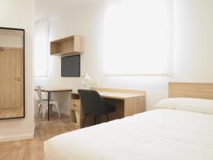 Postel nebo postele na pokoji v ubytování Micampus San Mamés Students Residence