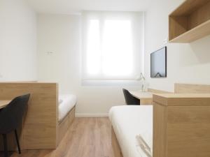 TV a/nebo společenská místnost v ubytování Micampus San Mamés Students Residence