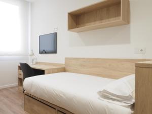 Postel nebo postele na pokoji v ubytování Micampus San Mamés Students Residence