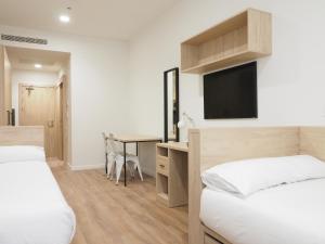 Postel nebo postele na pokoji v ubytování Micampus San Mamés Students Residence