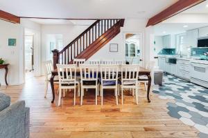 a kitchen and dining room with a table and chairs at Town of Rehoboth 20 Delaware Ave in Rehoboth Beach
