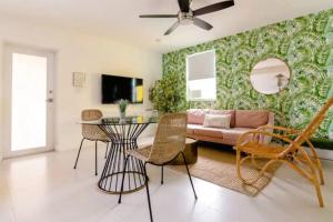 a living room with a couch and a table at Miami Vice - Wynwood Studios by Pattio in Miami