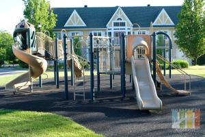 a playground in front of a house with slides at Horseshoe Retreat in Edgar
