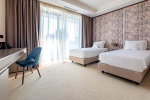 מיטה או מיטות בחדר ב-Hotel Stein Collection