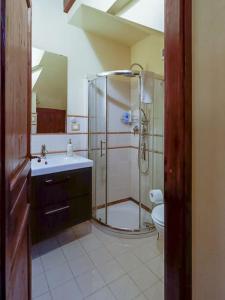 a bathroom with a shower and a sink and a toilet at Casa all'Annunziata in Termini Imerese