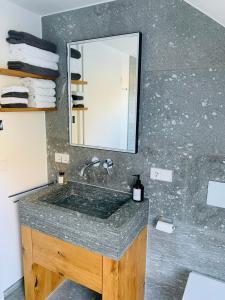 a bathroom with a sink and a mirror at Loft über dem Bodensee in Heiligenberg