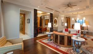 a living room with a couch and a table at InterContinental Grand Ho Tram in Ho Tram