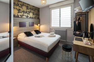 Letto o letti in una camera di Hôtel du Musée