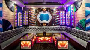 a room with a bar with a poker table at InterContinental Grand Ho Tram in Ho Tram