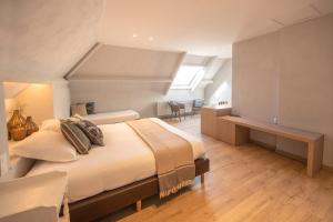 Postel nebo postele na pokoji v ubytování Guesthouse Brouwershuis + 9 fotografií