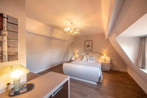 Postel nebo postele na pokoji v ubytování Guesthouse Brouwershuis