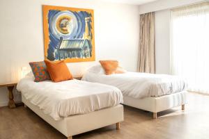 Postel nebo postele na pokoji v ubytování Guesthouse Brouwershuis