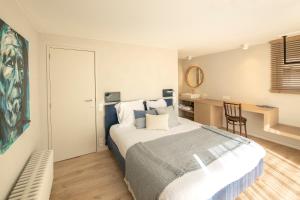 Postel nebo postele na pokoji v ubytování Guesthouse Brouwershuis