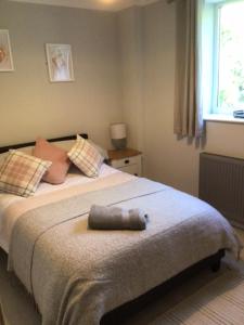 a bedroom with a bed with a stuffed animal on it at Letterston Valley View in Haverfordwest