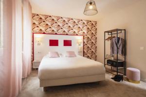 Letto o letti in una camera di Hôtel du Musée