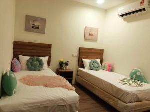 Cama ou camas em um quarto em SCC Velodrome KL