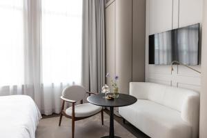 Pillows Grand Boutique Hotel Maurits at the Park - Small Luxury Hotels的电视和/或娱乐中心