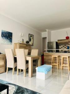 a kitchen and dining room with a table and chairs at CHARMING APARTMENT NEAR THE BEACH in Villefranche-sur-Mer