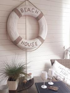 a beach house wreath hanging on a wall at Beach House in Międzyzdroje