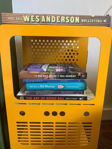 a stack of books in a yellow microwave at This must be the place - Skye, Carbost in Carbost