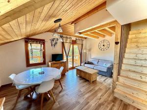 Televízia a/alebo spoločenská miestnosť v ubytovaní Studio Ptilou B36 2/4 pers. avec vue