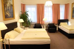 Postel nebo postele na pokoji v ubytování Hotel Adler