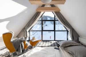 Łóżko lub łóżka w pokoju w obiekcie Apartamenty Pod Stokiem Nosal Zakopane