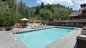 a swimming pool in a resort with a mountain at 2 Bedroom Condo - The Lodges at Deer Valley condo in Park City