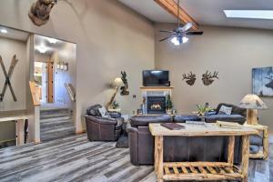 a living room with leather furniture and a fireplace at Family-Friendly Home with Hot Tub 1 Mi to Dtwn in Estes Park