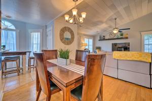 a dining room and kitchen with a table and chairs at Peaceful Wilmington Home Near Beach and Downtown! in Carolina Beach