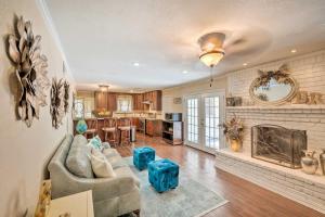 a living room with a couch and a fireplace at Pet-Friendly Home about 6 Mi to Downtown Fort Worth! in Fort Worth