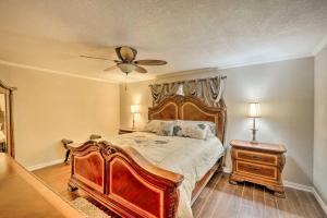 a bedroom with a large bed and a ceiling fan at Pet-Friendly Home about 6 Mi to Downtown Fort Worth! in Fort Worth