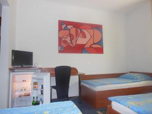 Postel nebo postele na pokoji v ubytování Hotel Pri Belokranjcu